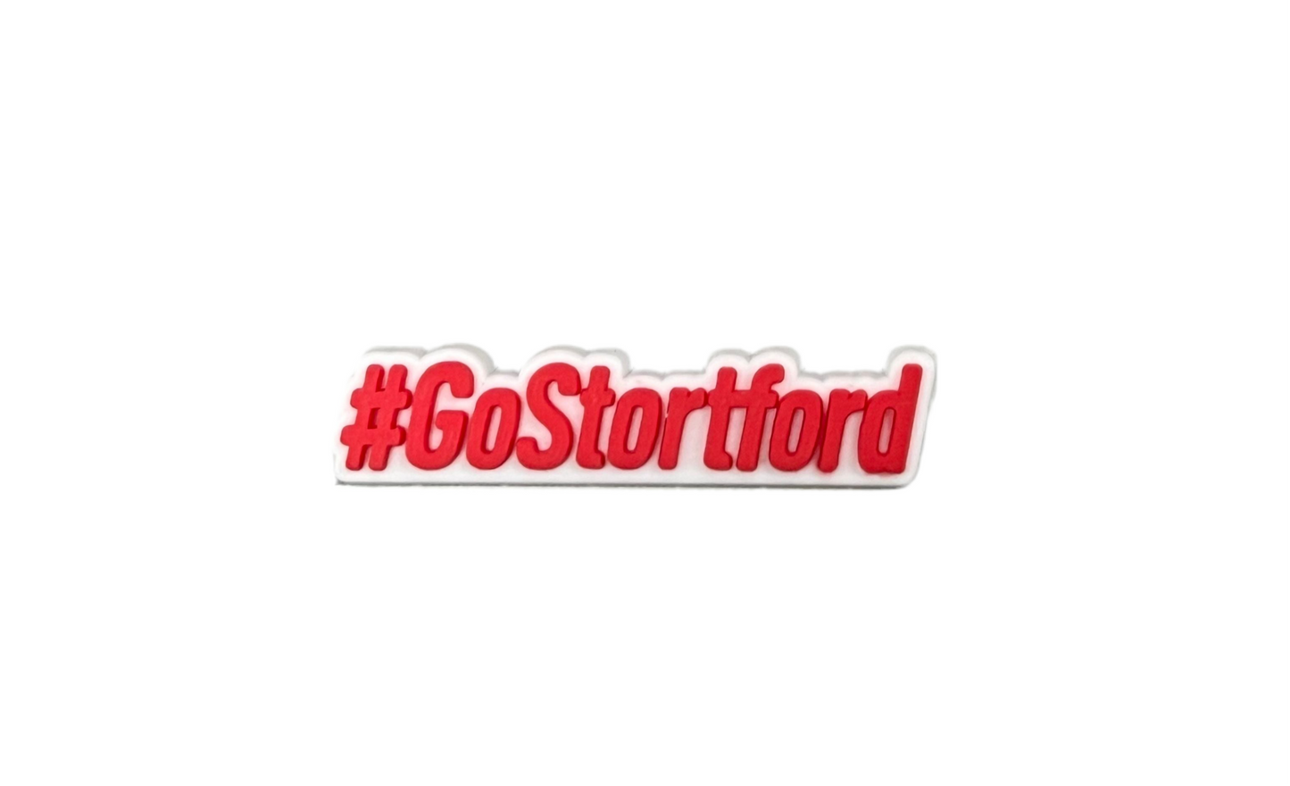 The Bishops Stortford Swimming Club Shoe Charm - Go Stortford (Red) by All4Swim features bold red "#GoStortford" text with a white outline—an ideal poolside accessory or swimming charm for your collection.