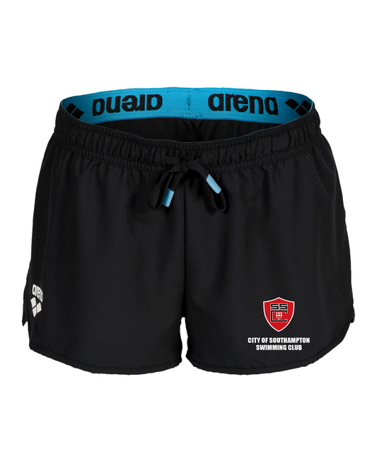 The COS Arena Team Women’s Shorts by Arena feature a blue waistband, drawstring, white logos, and the City of Southampton Swimming Club crest. Made from quick-drying recycled polyester, these black training shorts are perfect for women.