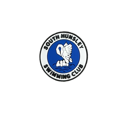 The South Hunsley Swimming Club Shoe Charm by All4Swim features a circular logo with a white swan on blue water, encircled by the club name—an ideal poolside accessory or distinctive swimming charm.